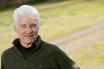 Philip J. Cook (headshot), professor emeritus of public policy, economics, sociology at Duke University, man with short white hair, gray mustache, green fleece jacket.